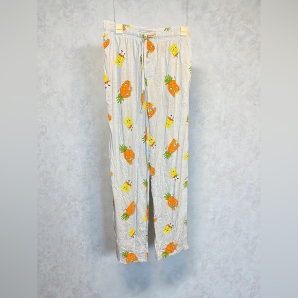 Nickelodeon Other - Nickelodeon White Pants with Orange and Yellow Print